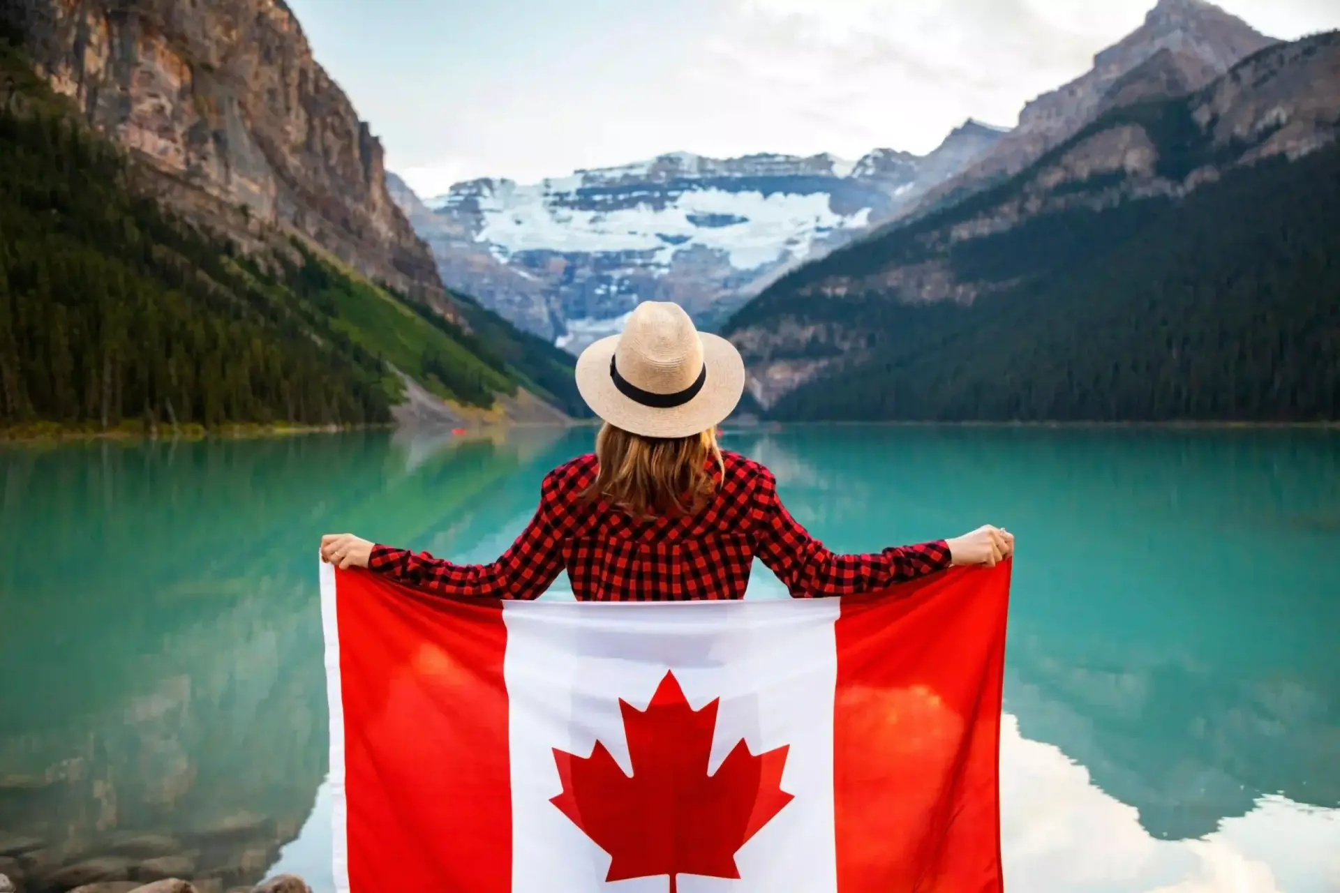 Image of a girl holding the Canadian flag, highlighting Vertex Foreign Consultancy's study abroad services for top Canadian universities.